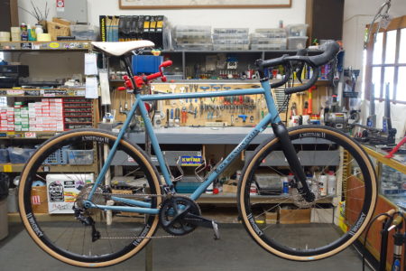 blue prototype light blue Black Mountain Cycles Road DIsc bike in work stand